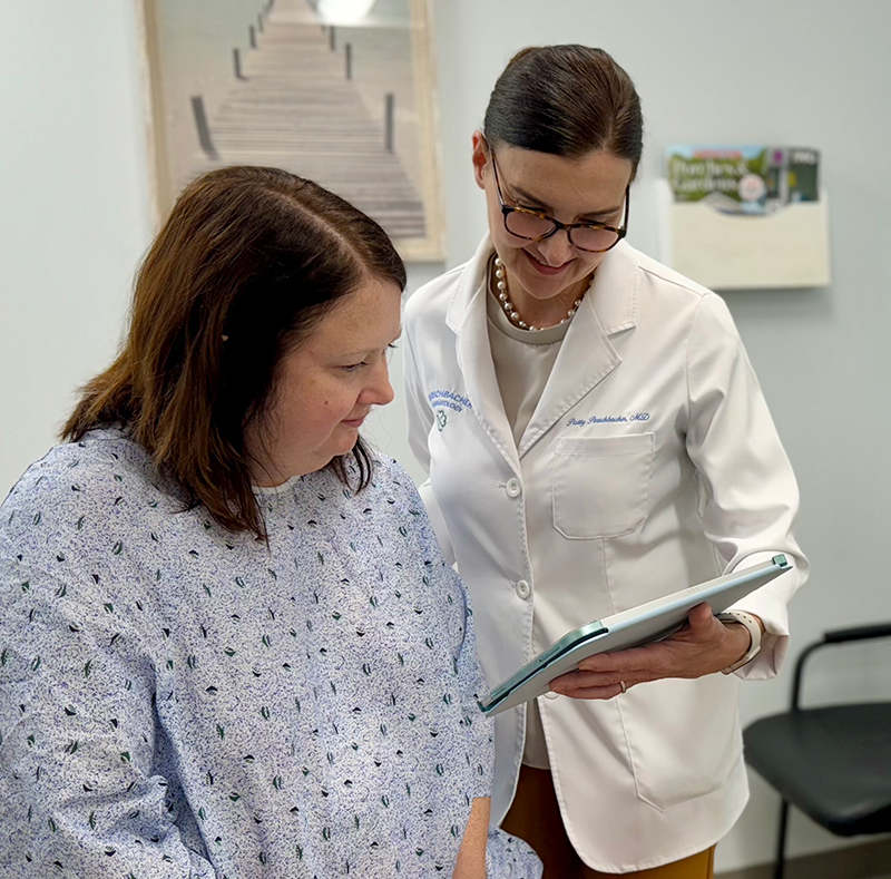 Dr. Perschbacher examining a patient